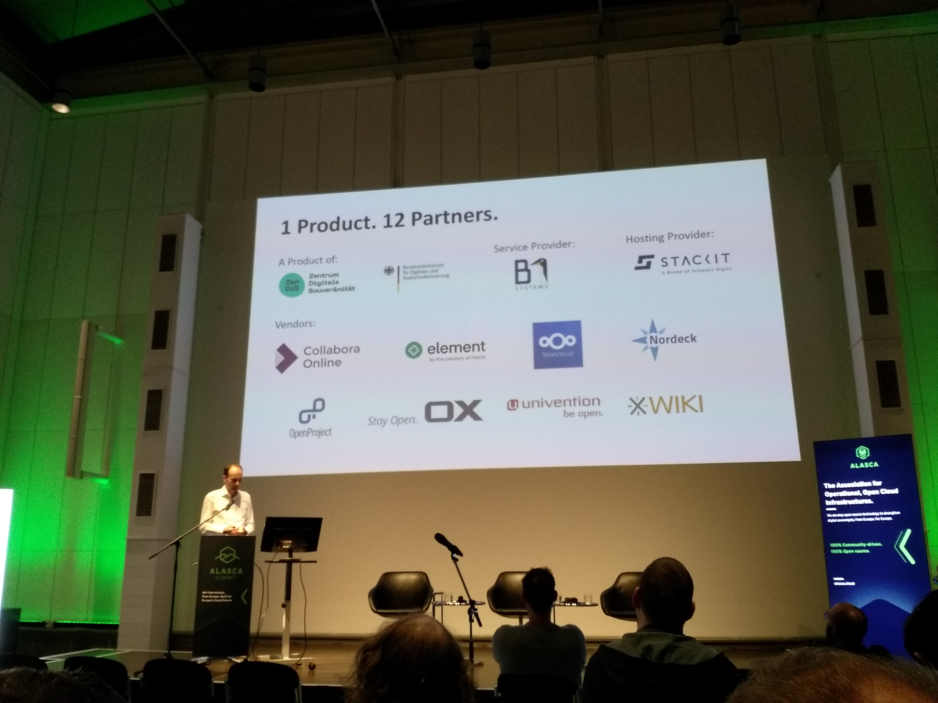 openDesk — 1 Product. 12 Partners. Slide showing ZenDiS, B1 Systems, STACKIT, and eight open-source vendors at ALASCA Summit 2025